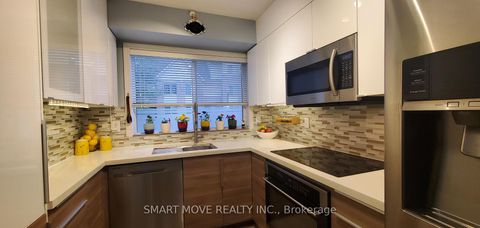 Photo 5 at TH 25 - 21 Replin Road, Lawrence, Toronto