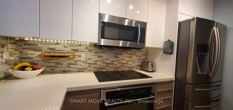 Photo 6 at TH 25 - 21 Replin Road, Lawrence, Toronto