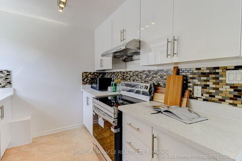 Photo 4 at 34 Merrian Road, Kennedy Park, Toronto