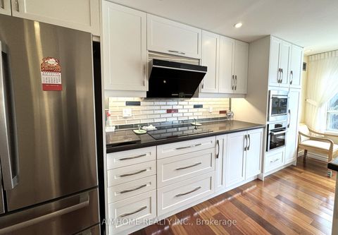 Photo 7 at 404 - 175 Bamburgh Circle, Steeles, Toronto