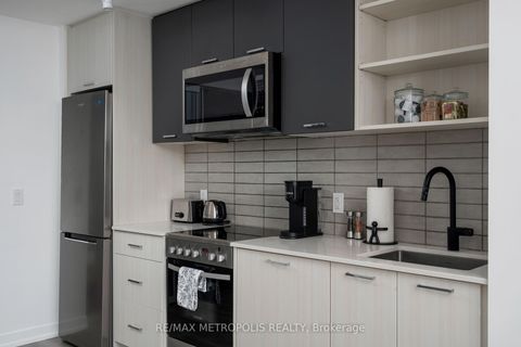 Photo 1 at 307 - 2300 St Clair Avenue W, Junction Area, Toronto