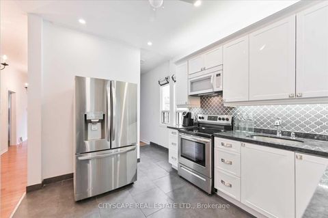 Photo 14 at 15 Midburn Avenue, Crescent Town, Toronto