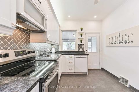 Photo 15 at 15 Midburn Avenue, Crescent Town, Toronto
