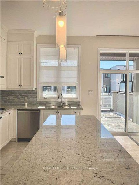 Photo 3 at 605 Marc Santi Boulevard, Patterson, Vaughan