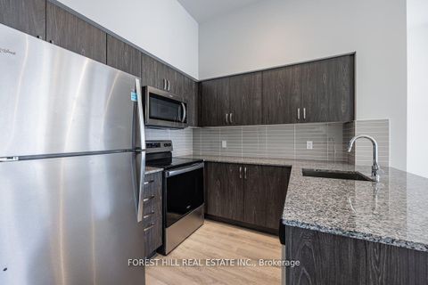 Photo 3 at 105 - 10 Meadowglen Place, Woburn, Toronto