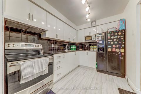 Photo 11 at 1 - 34 Dundalk Drive, Dorset Park, Toronto