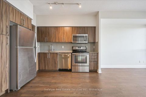 Photo 12 at Lph 01 - 55 Speers Road, CO Central, Oakville