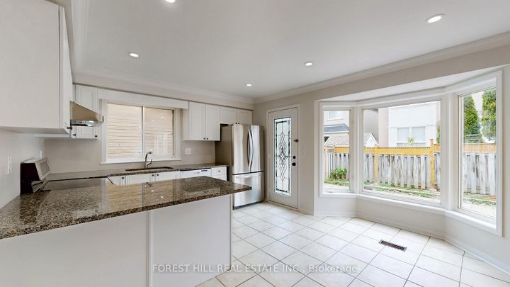 Photo 6 at 4 Lionheart Lane, Berczy, Markham