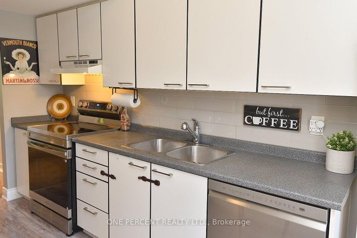 Photo 15 at 203 - 2075 Walkers Line, Rose, Burlington