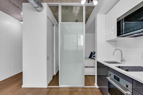 Photo 3 at 310 - 21 Lawren Harris Square, Moss Park, Toronto