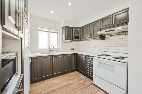 Photo 10 at 48 - 2012 Martingrove Road W, Clairville, Toronto