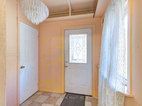 Photo 3 at 11 Midburn Avenue, Crescent Town, Toronto