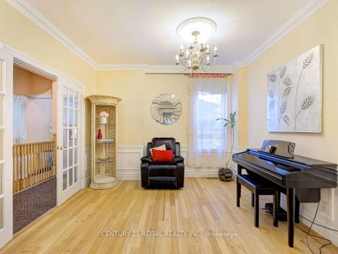 Photo 9 at 11 Midburn Avenue, Crescent Town, Toronto