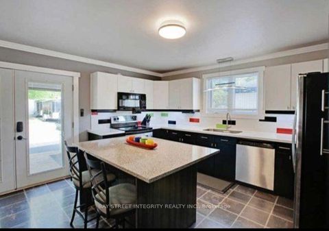 Photo 1 at 57 Howard Road, Leslie Valley, Newmarket