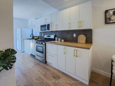 Photo 7 at 32 Brenton Street, Crescent Town, Toronto