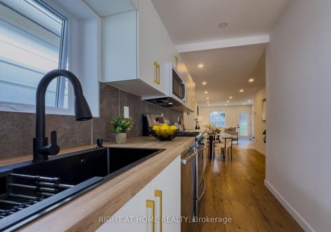 Photo 8 at 32 Brenton Street, Crescent Town, Toronto
