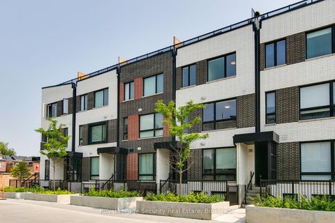 Photo 1 at TH 22 - 40 Ed Clark Gardens, Pellam Park, Toronto