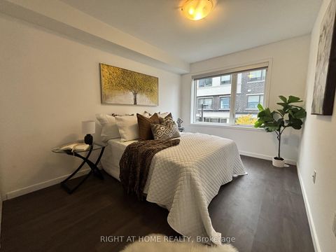 Photo 11 at 59 - 300 Alex Gardner Circle E, Aurora Village, Aurora