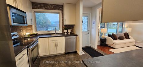 Photo 1 at 67 Savona Drive, Alderwood, Toronto