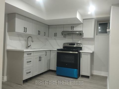 Photo 2 at 32 CONLINS RD E, Highland Creek, Toronto