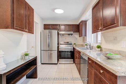 Photo 11 at 23 Thimble Berry Way, Hillcrest Village, Toronto