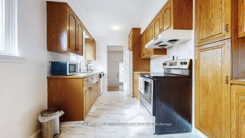 Photo 11 at 15 Thistlewaite Crescent, Malvern West, Toronto