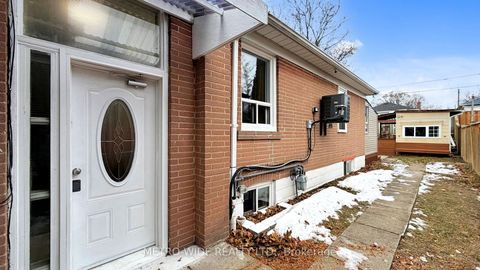 Photo 2 at 34 Merrian Road, Kennedy Park, Toronto