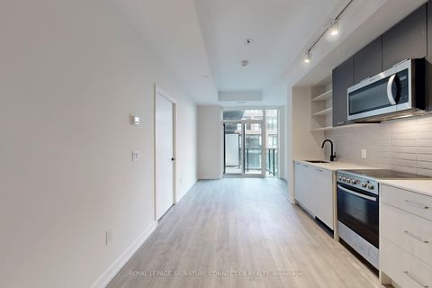 Photo 2 at 612 - 2300 St Clair Avenue W, Junction Area, Toronto
