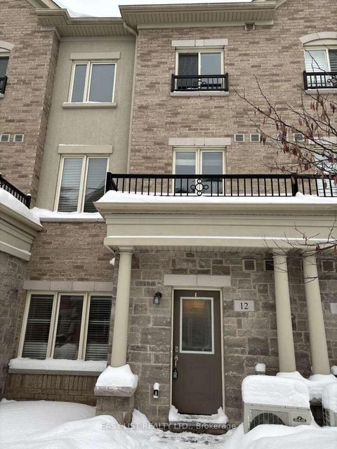 Photo 1 at 12 - 25 Coneflower Crescent, Branson, Toronto