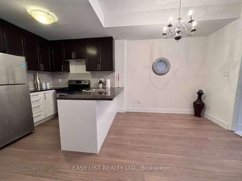 Photo 3 at 12 - 25 Coneflower Crescent, Branson, Toronto