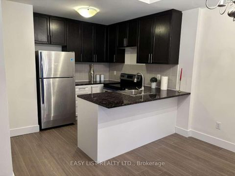 Photo 6 at 12 - 25 Coneflower Crescent, Branson, Toronto