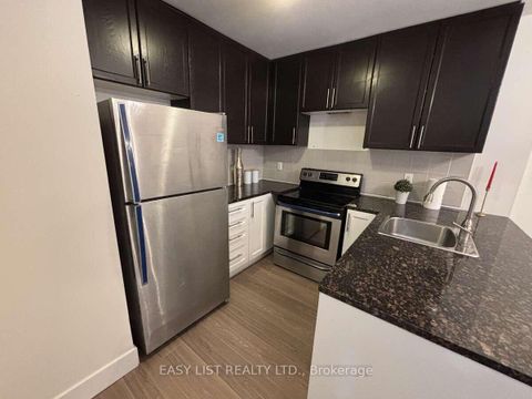 Photo 7 at 12 - 25 Coneflower Crescent, Branson, Toronto