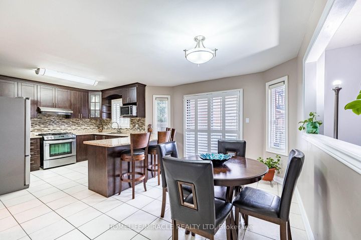 Photo 11 at 9 Ballycastle Crescent, Heart Lake West, Brampton