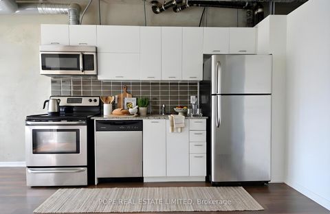 Photo 1 at 312 - 38 Joe Shuster Way, South Parkdale, Toronto