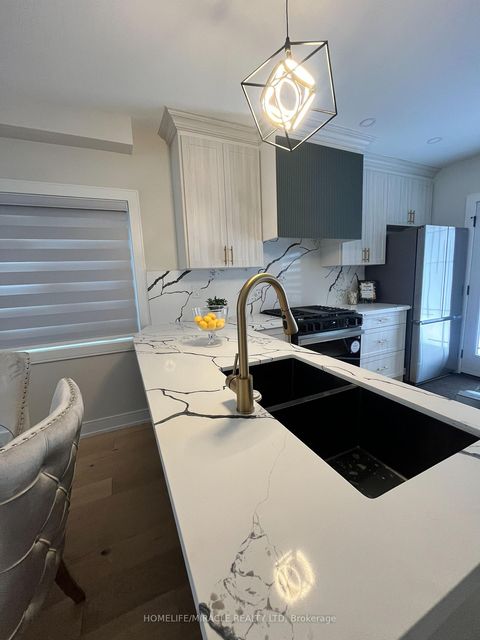 Photo 3 at 12 Thyra Avenue, Crescent Town, Toronto