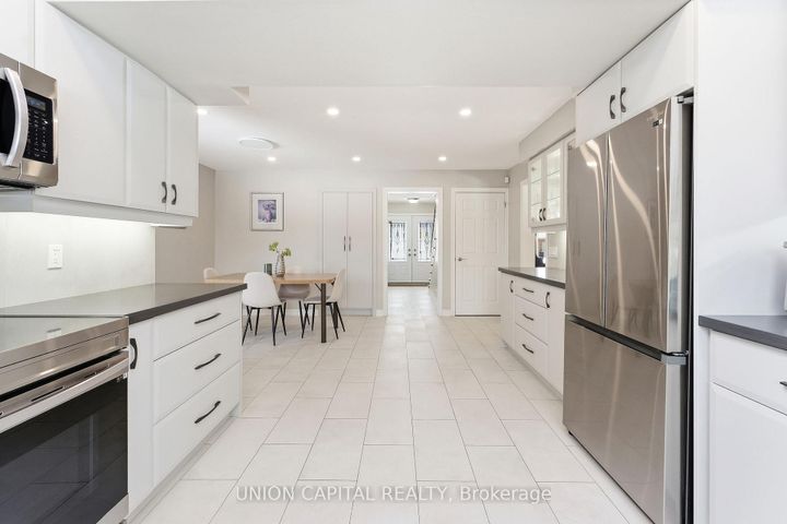 Photo 4 at 53 Stubbswood Square, Malvern West, Toronto