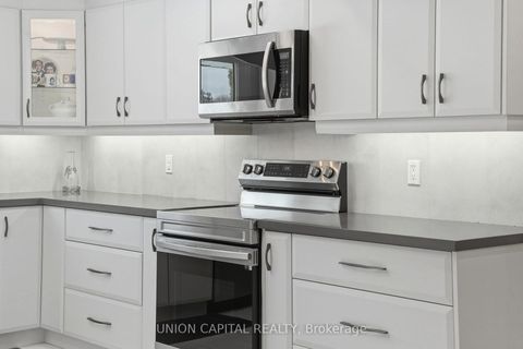 Photo 5 at 53 Stubbswood Square, Malvern West, Toronto