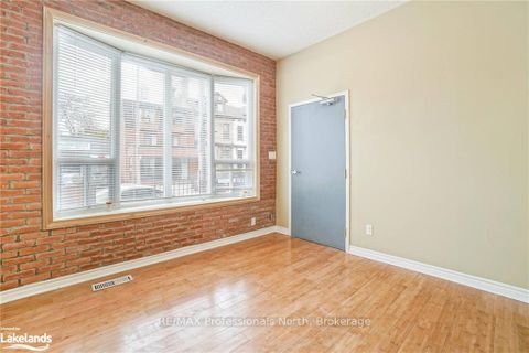 Photo 2 at 214 Gerrard Street E, South St. James Town, Toronto