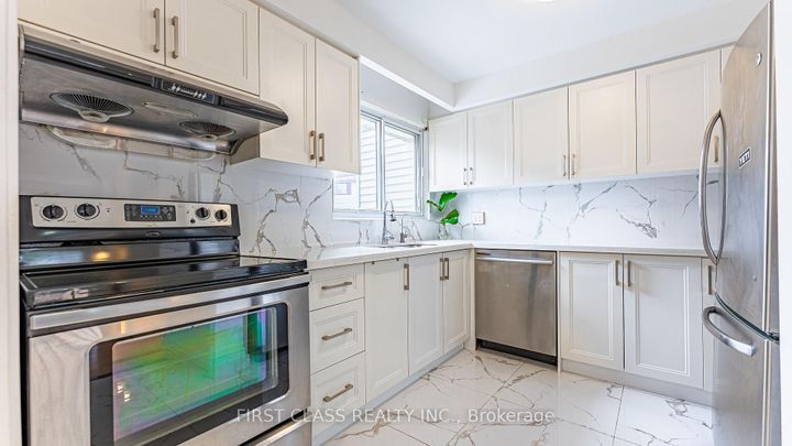 Photo 4 at 102 Jenny Wrenway Way, Hillcrest Village, Toronto