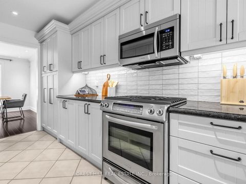 Photo 7 at 40 Snowshoe Mill Way, Windfields, Toronto