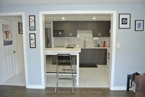 Photo 1 at 54 - 850 Huntingwood Drive, L'Amoreaux, Toronto