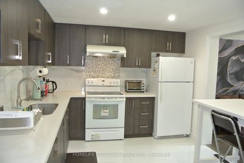 Photo 2 at 54 - 850 Huntingwood Drive, L'Amoreaux, Toronto