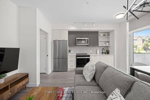 Photo 1 at 101 - 2300 St Clair Avenue W, Junction Area, Toronto