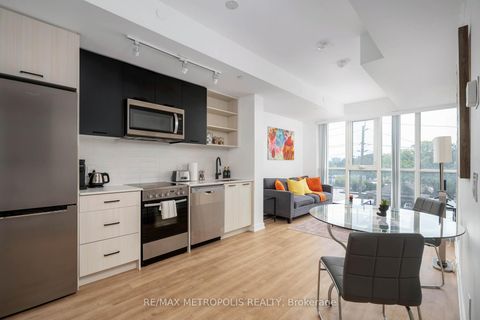 Photo 1 at 407 - 2300 St Clair Avenue W, Junction Area, Toronto
