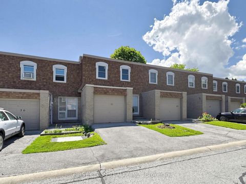 Photo 1 at 38 - 850 Huntingwood Drive, L'Amoreaux, Toronto