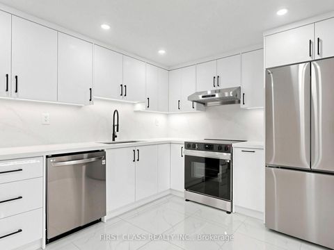 Photo 3 at 38 - 850 Huntingwood Drive, L'Amoreaux, Toronto