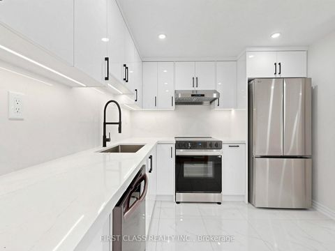 Photo 4 at 38 - 850 Huntingwood Drive, L'Amoreaux, Toronto
