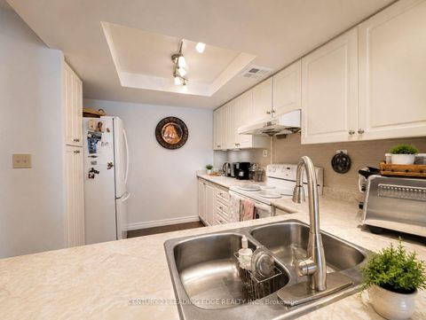 Photo 8 at 310 - 275 Bamburgh Circle, Steeles, Toronto
