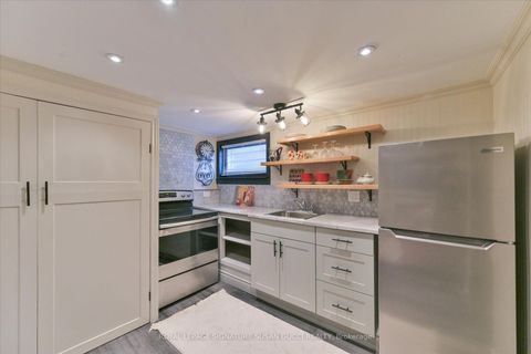 Photo 31 at 8 Sutherland Avenue, Crescent Town, Toronto