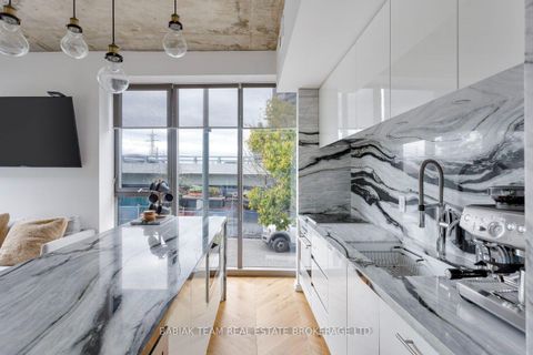 Photo 5 at TH 209 - 20 Trolley Crescent, Moss Park, Toronto
